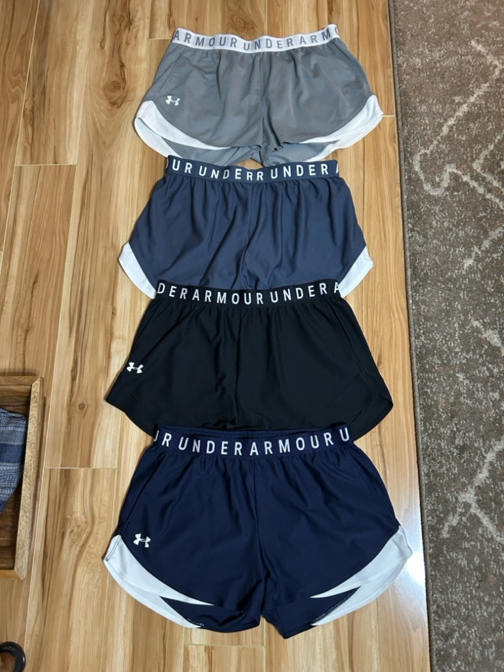 Under Armour Women's 4-Pack Athletic Shorts - Black, Navy, Gray, Charcoal - Picture 2 of 4